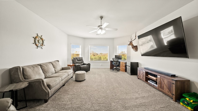 living room featuring carpet floors and ceiling fan