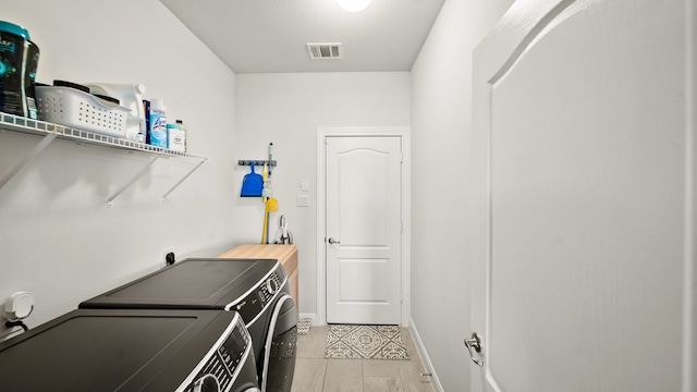 washroom featuring independent washer and dryer