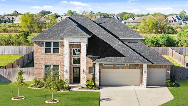 view of front facade featuring a front yard and a garage