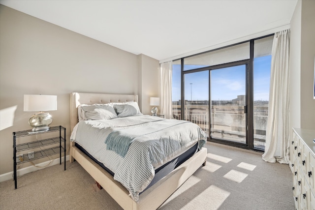 carpeted bedroom with access to outside