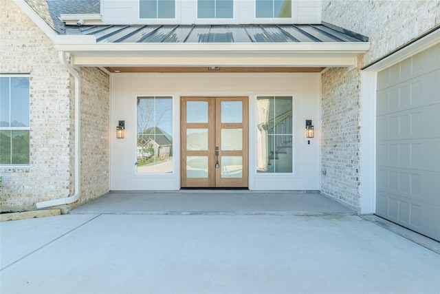 property entrance featuring french doors