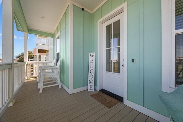 wooden terrace with a porch