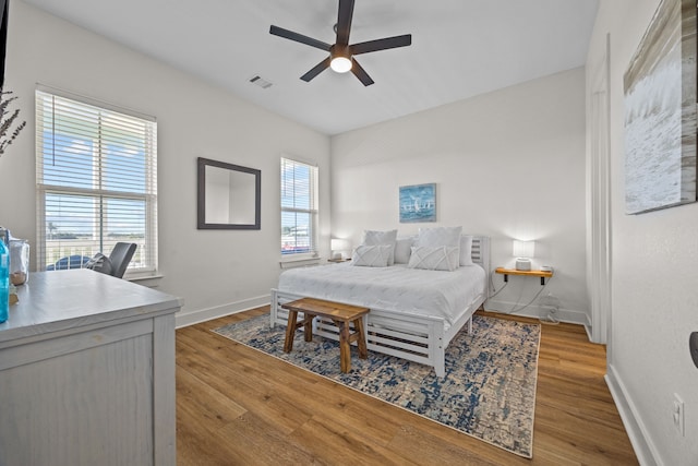 bedroom featuring hardwood / wood-style floors and ceiling fan