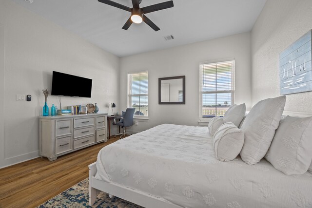 bedroom featuring ceiling fan and wood-type flooring