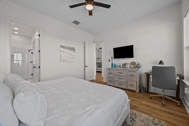 bedroom featuring ceiling fan, connected bathroom, and light hardwood / wood-style flooring