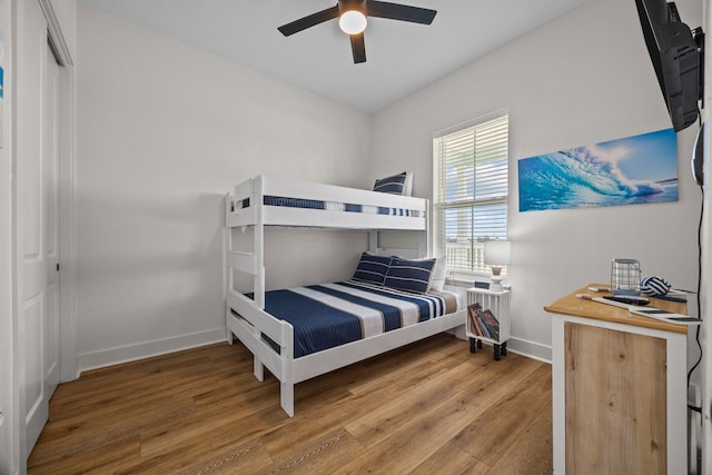 bedroom with ceiling fan and hardwood / wood-style floors