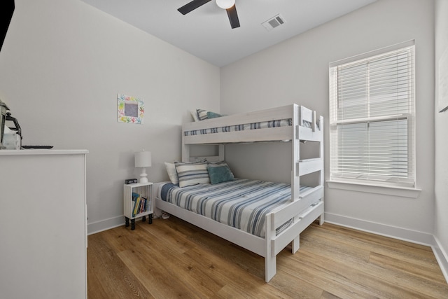 bedroom featuring hardwood / wood-style floors and ceiling fan