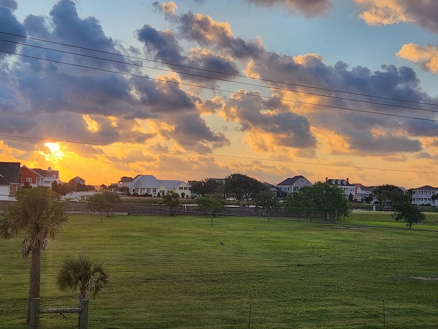 view of yard at dusk