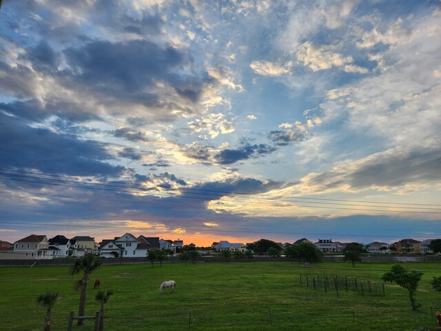 view of yard at dusk