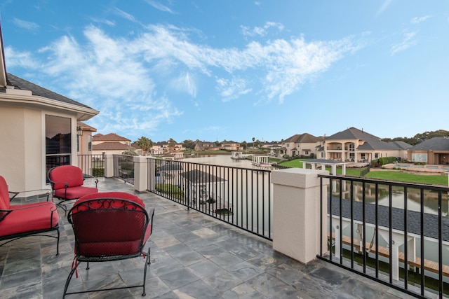 balcony featuring a water view