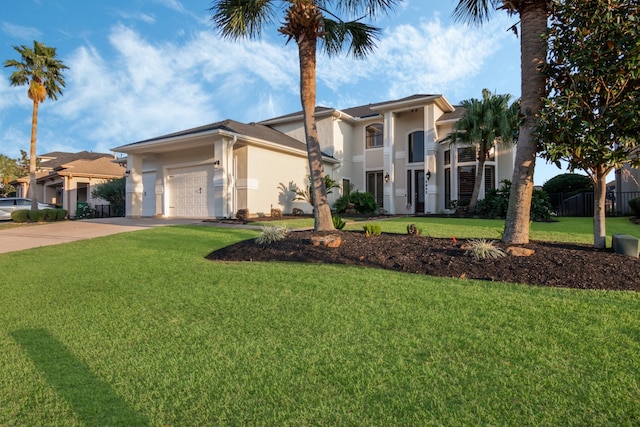 view of front of house with a front lawn and a garage