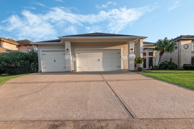 ranch-style house featuring a garage and a front yard