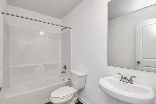 full bathroom with tub / shower combination, toilet, and sink