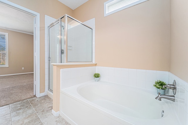 bathroom featuring tile patterned flooring, separate shower and tub, and crown molding