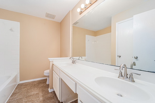 full bathroom featuring vanity, toilet, and tiled shower / bath