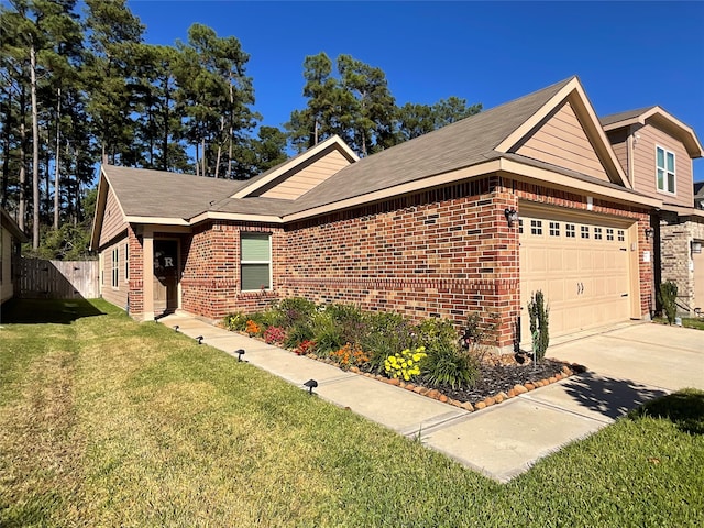 single story home featuring a garage and a front lawn