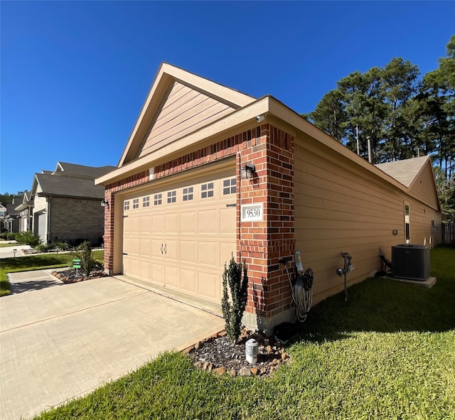 view of property exterior featuring central AC unit and a garage