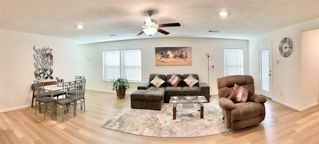 living room with ceiling fan and light wood-type flooring