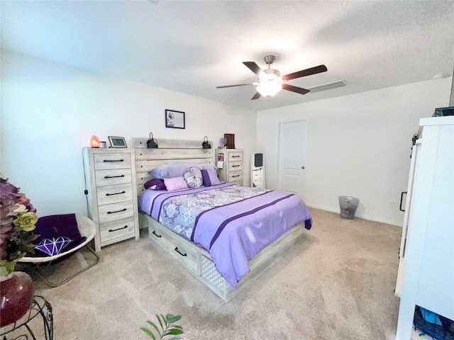 bedroom featuring ceiling fan and light carpet