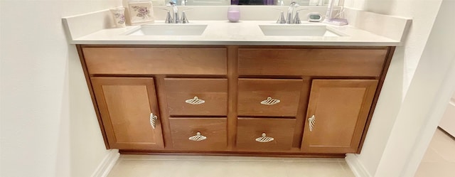 interior details with tile patterned floors and sink