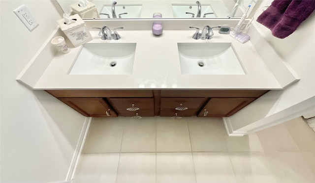 bathroom with tile patterned flooring and vanity