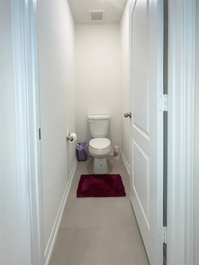 bathroom featuring tile patterned flooring and toilet