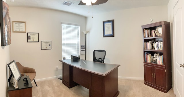 carpeted office space with ceiling fan