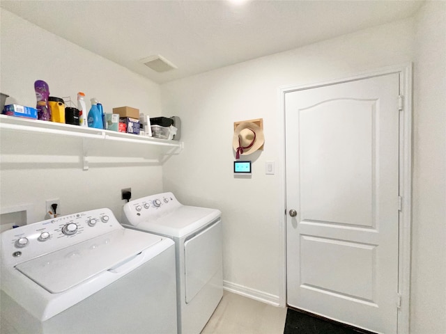 laundry room with washer and dryer