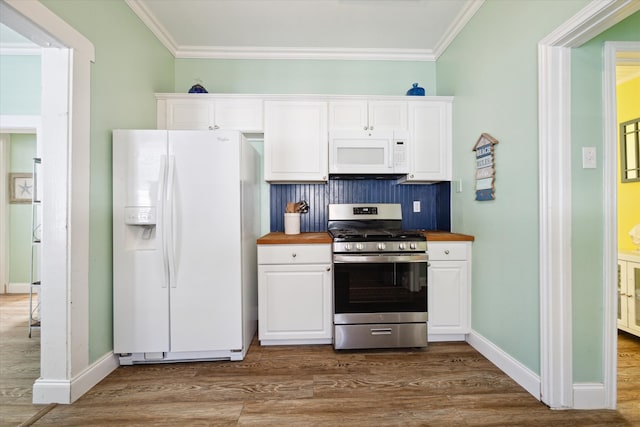 kitchen featuring white appliances, crown molding, white cabinets, dark hardwood / wood-style floors, and butcher block counters