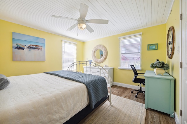 bedroom featuring ceiling fan and dark wood-type flooring