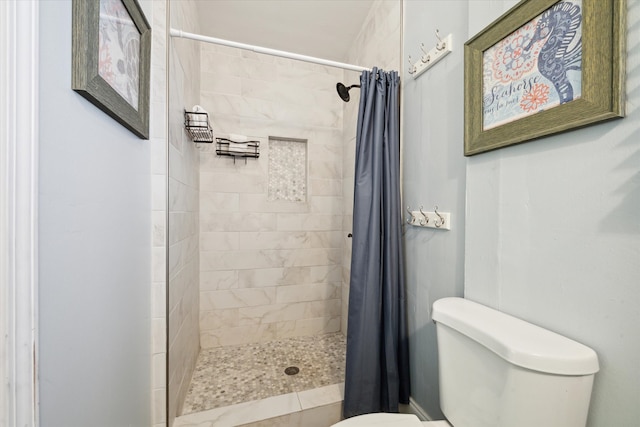 bathroom with toilet and curtained shower