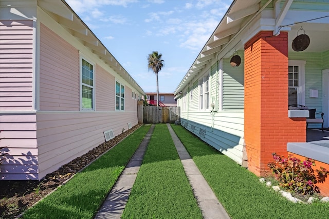 view of property exterior featuring a lawn