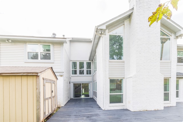 back of house with a wooden deck