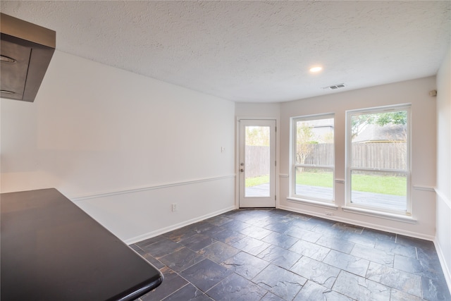 interior space featuring a textured ceiling