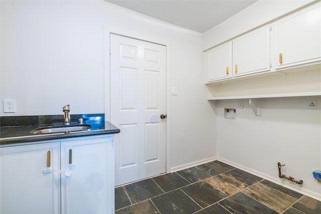 laundry room with gas dryer hookup, cabinets, sink, and hookup for a washing machine