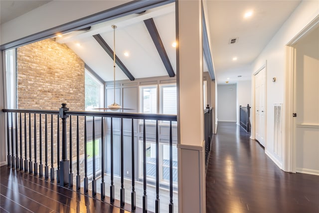 hallway featuring vaulted ceiling with beams and dark wood-type flooring