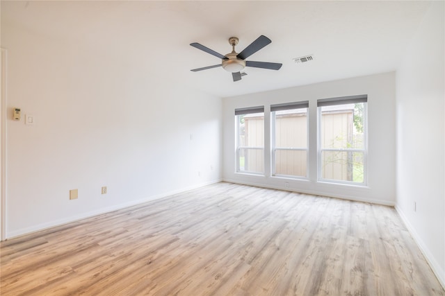 spare room featuring light wood-type flooring and ceiling fan