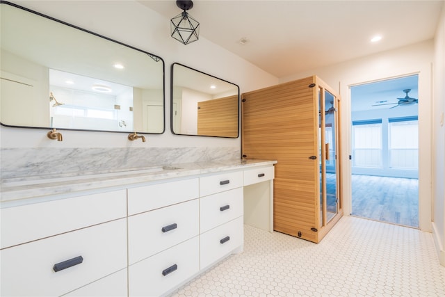 bathroom with vanity and ceiling fan