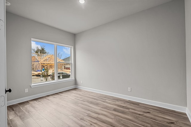 unfurnished room featuring light hardwood / wood-style flooring