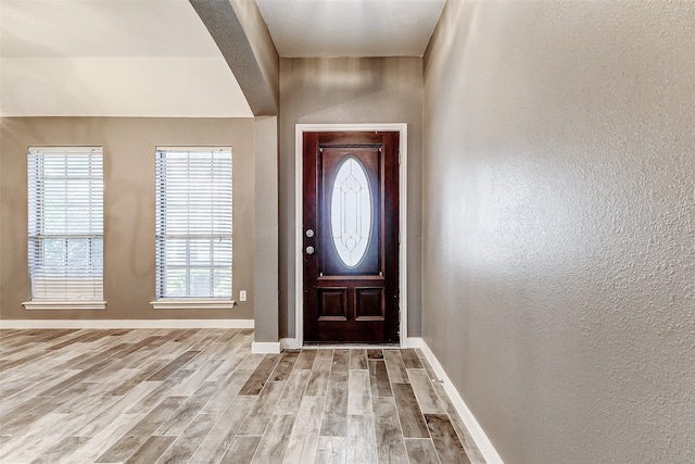 foyer entrance with light wood-type flooring