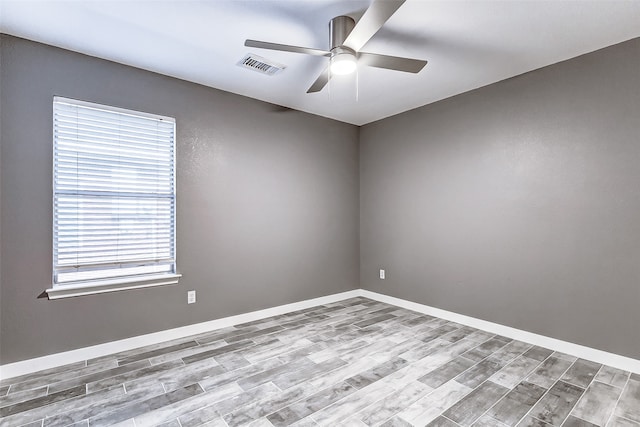 unfurnished room with ceiling fan and light wood-type flooring