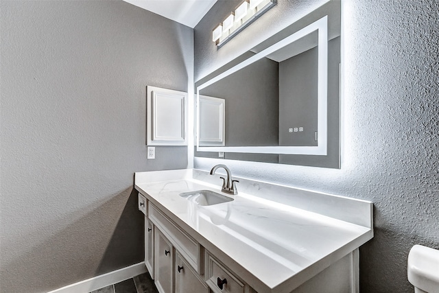 bathroom featuring hardwood / wood-style floors and vanity