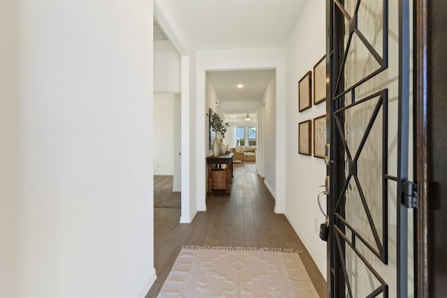 corridor featuring hardwood / wood-style flooring