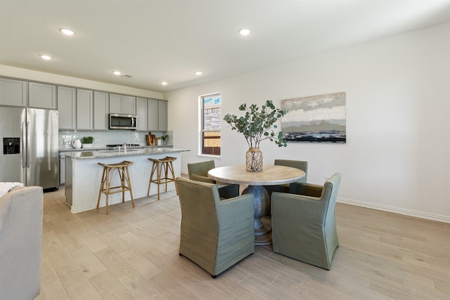 dining space featuring light hardwood / wood-style flooring