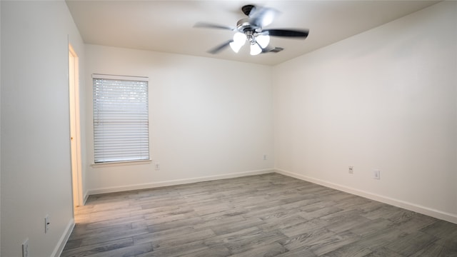 unfurnished room with ceiling fan and hardwood / wood-style floors