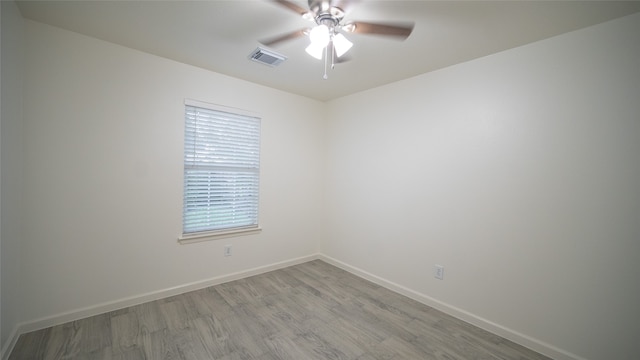 empty room featuring ceiling fan and light wood-type flooring