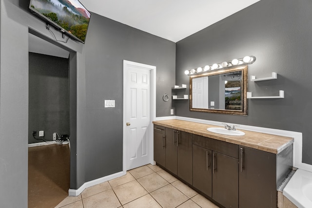 bathroom with tile patterned floors and vanity