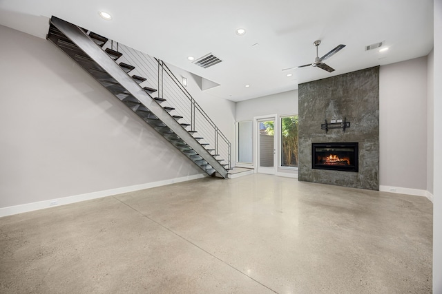 unfurnished living room with a fireplace and ceiling fan