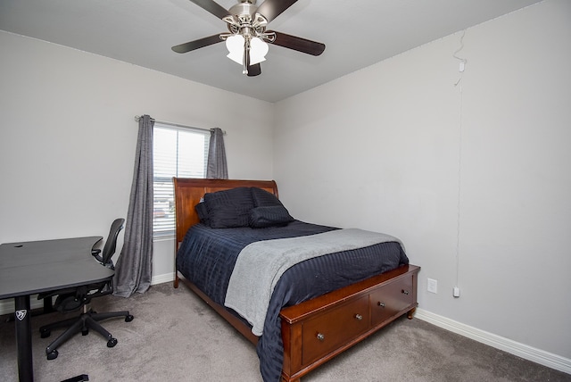 bedroom with ceiling fan and light carpet