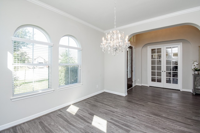 unfurnished dining area featuring french doors, dark hardwood / wood-style flooring, and crown molding